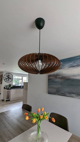 Customer photo (walnut): Ellipse wooden pendant light in an open-plan kitchen and dining room