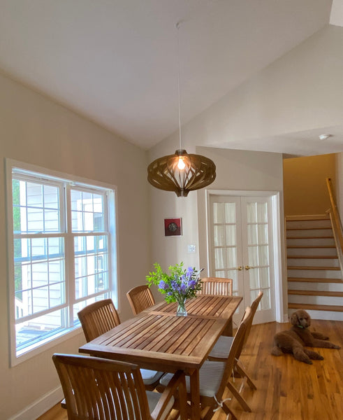 Customer photo (oak): Medusa wooden pendant light over a dining table