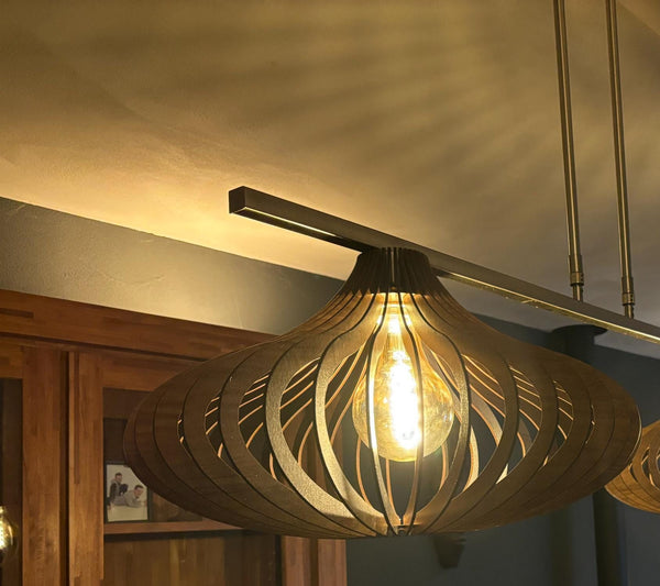 Customer photo (walnut): Teardrop wooden pendant light lit in the evening