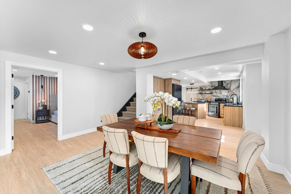 Customer photo (walnut): Ellipse wooden pendant light in an open dining room